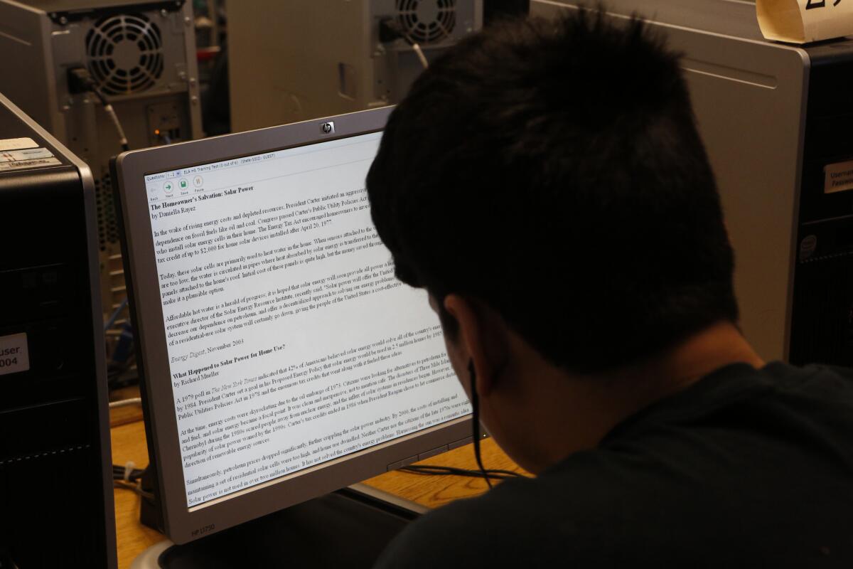 A student takes a practice test for the new statewide standardized tests to measure understanding of Common Core Standards in math and English.