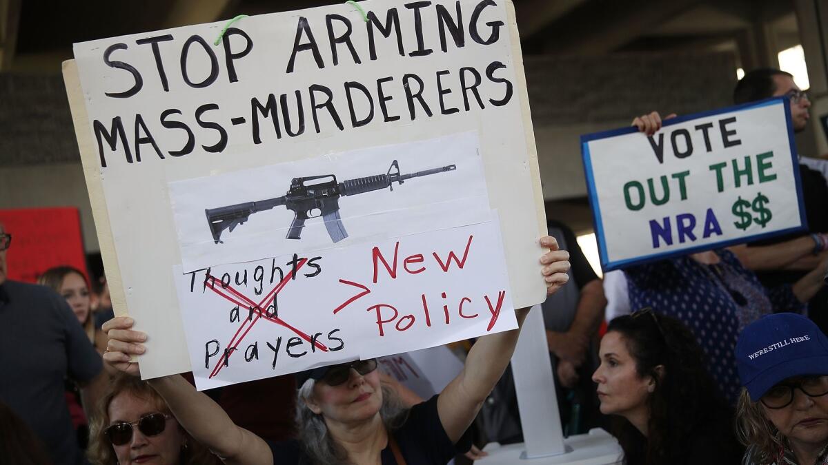 Protesters call for more gun-control laws at the Broward County Federal courthouse in Fort Lauderdale, Fla., on Feb. 17.