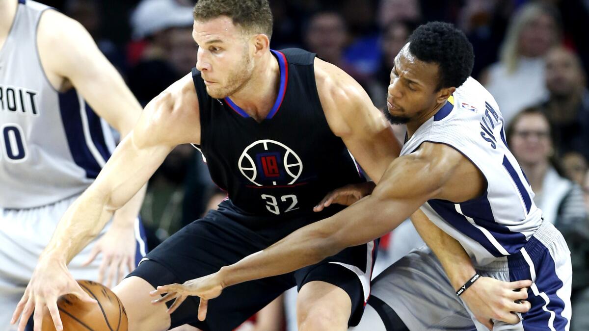 Clippers forward Blake Griffin tries to protect the ball from the reach of Pistons guard Ish Smith during their game Friday night.