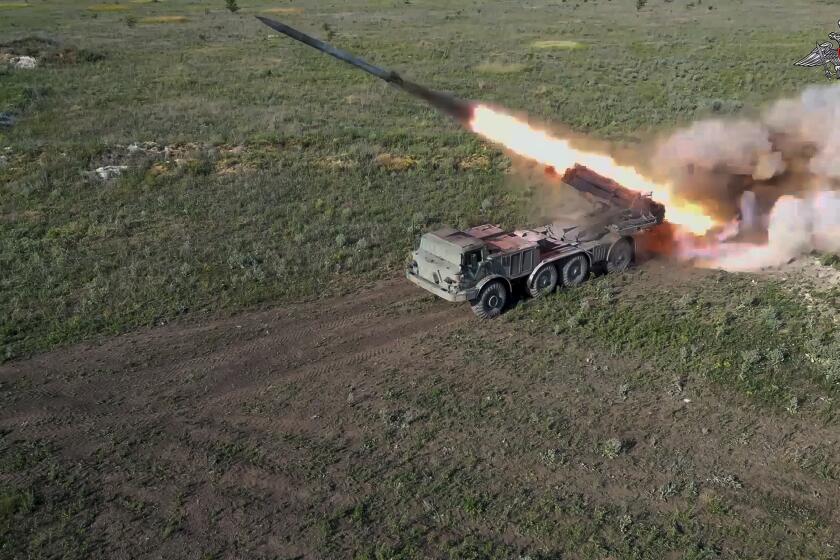 In this photo taken from video released by the Russian Defense Ministry on Friday, July 19, 2024, a Russian self-propelled multiple rocket launcher Uragan (Hurricane) fires toward Ukrainian position at an undisclosed location in Ukraine. (Russian Defense Ministry Press Service via AP)