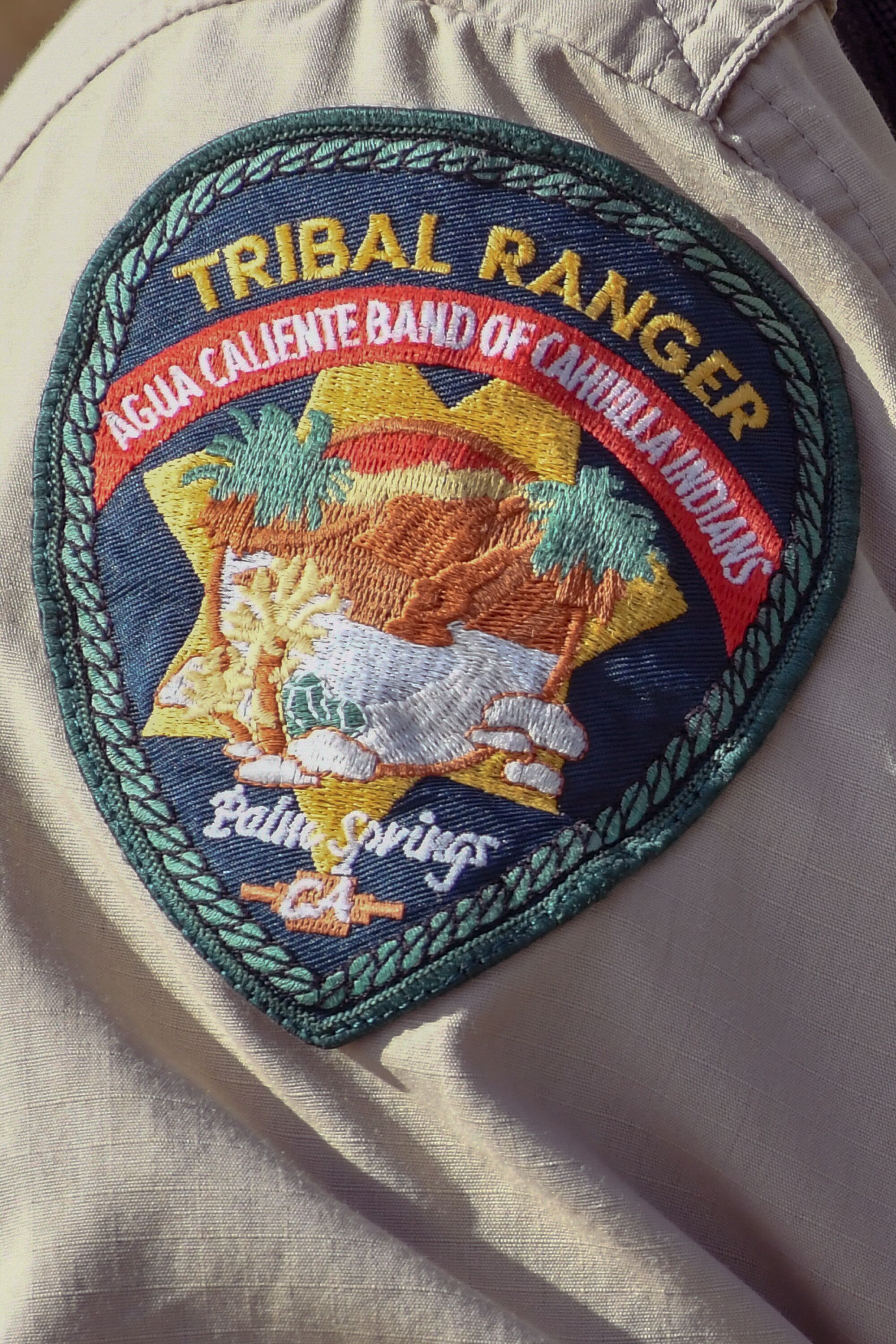 A close-up of a tribal ranger patch on a uniform
