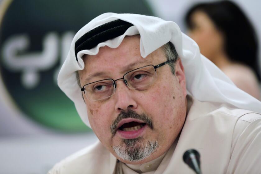 FILE - In this Dec. 15, 2014 file photo, Saudi journalist Jamal Khashoggi speaks during a press conference in Manama, Bahrain. A Turkish newspaper says in his final words, slain Saudi journalist Jamal Khashoggi urged his killers not to cover his mouth because he suffered from asthma and could suffocate. The Sabah newspaper on Tuesday, Sept. 10, 2019 published new excerpts of a recording of Khashoggi's conversation with members of a Saudi hit squad sent to kill him. (AP Photo/Hasan Jamali, File)
