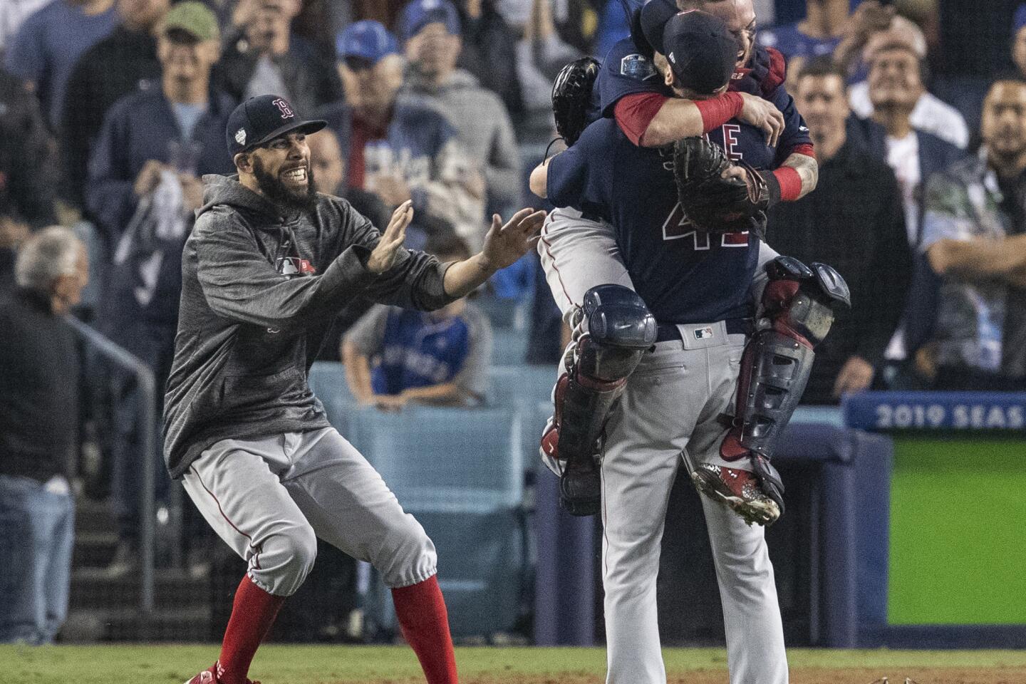Red Sox starting pitcher David Price joins starter-turned-reliever Chris Sale and catcher Christian Vazquez in celebrating a 5-1 win over the Dodgers to clinch the World Series title.
