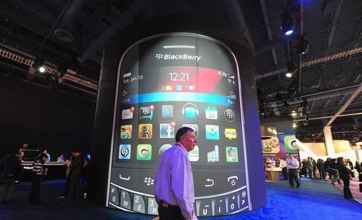 Apple and Samsung’s combined smartphone unit sales in the second quarter rose 43% year over year as sales for other brands fell 16%. BlackBerry and Nokia didn’t even make the top five brands in the U.S. Above, A man passes by a BlackBerry display in January at the International Consumer Electronics Show in Las Vegas.