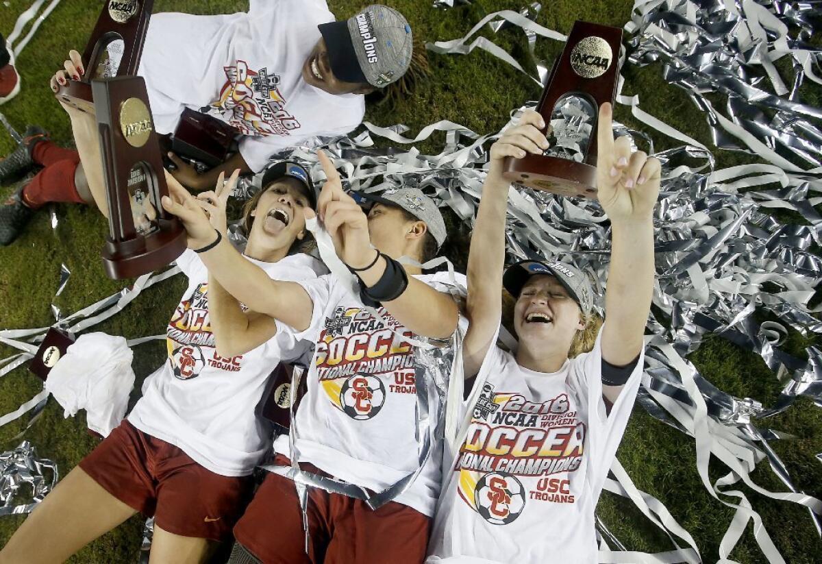 Flintridge Sacred Heart Academy graduates Katie Johnson, bottom left, and Kayla Mills, not pictured, won an NCAA women's soccer championship on Sunday with USC.