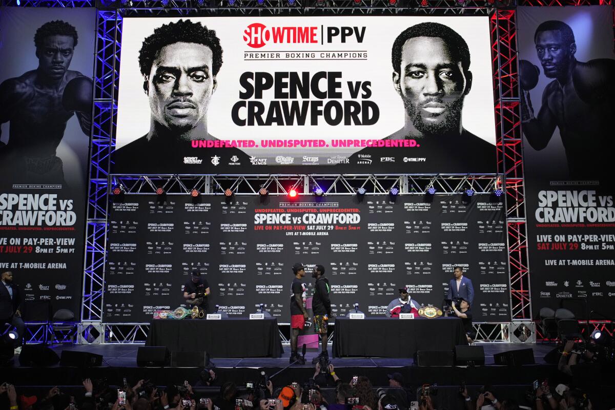 Errol Spence Jr., left, and Terence "Bud" Crawford pose during a news conference Thursday in Las Vegas. 