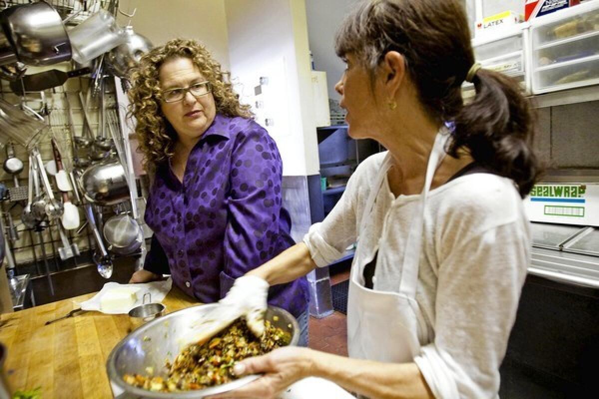"I was open for years when I probably should have closed," says Angeli Caffe's Evan Kleiman, left, pictured with chef Kathy Ternay in 2009. "It was my personal mission to get my employees past the worst of the recession."