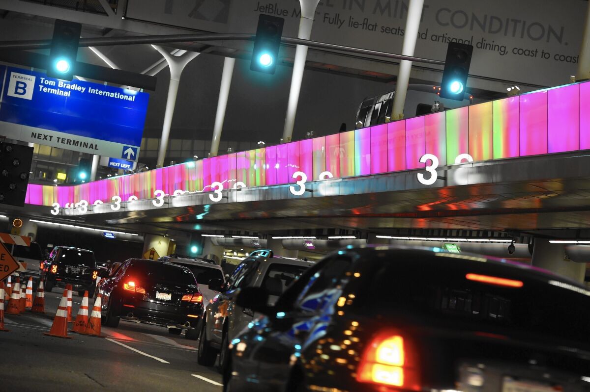 About half a million people are expected to watch about 6,500 athletes with intellectual disabilities representing 165 countries participate in the Special Olympics World Games, starting Saturday. Above, an LED lightband at Los Angeles International Airport programmed with the event's colors.