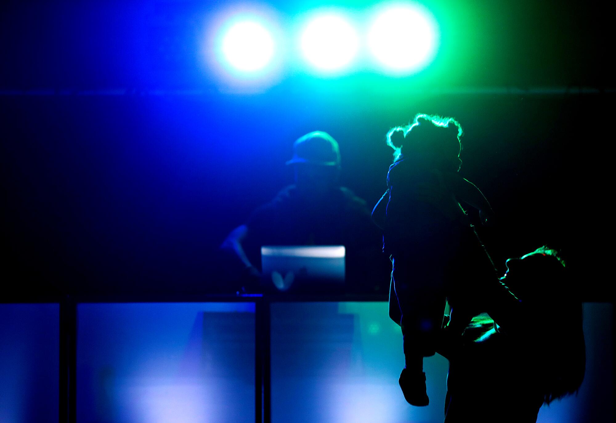 DJ E.T.'s wife, Iliana Hazzard, and their 1½-year-old daughter, Daphne, enjoy a Baby Rave as he plays the music.