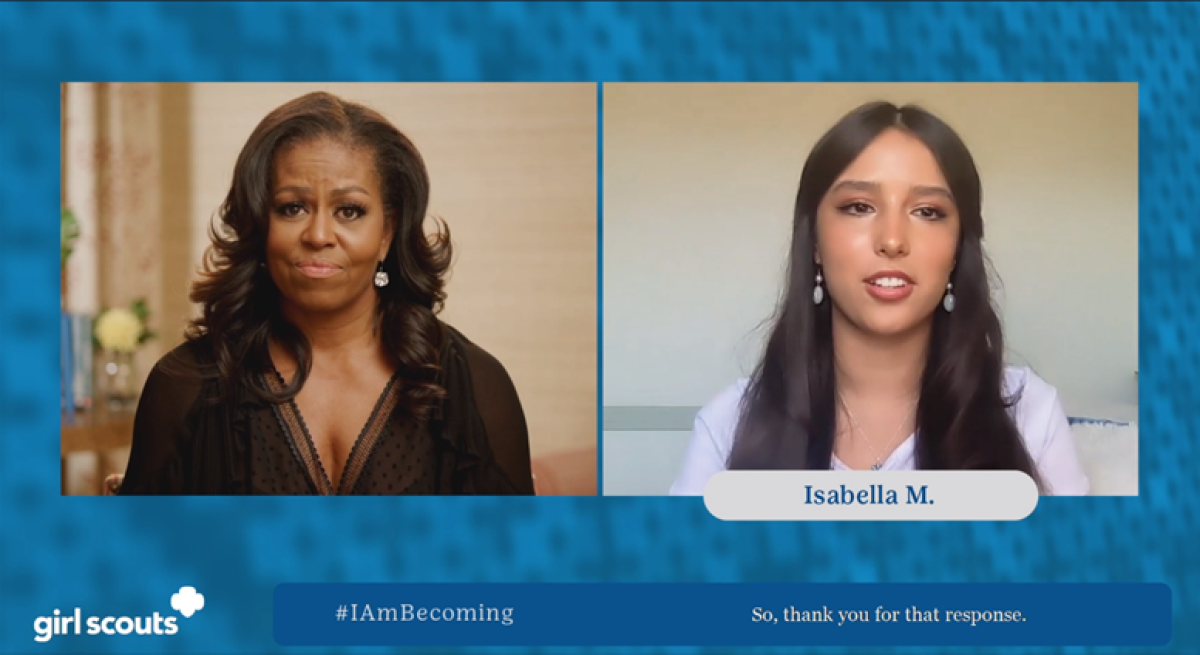 Former First Lady Michelle Obama and Girl Scout alum Isabella Madrigal.