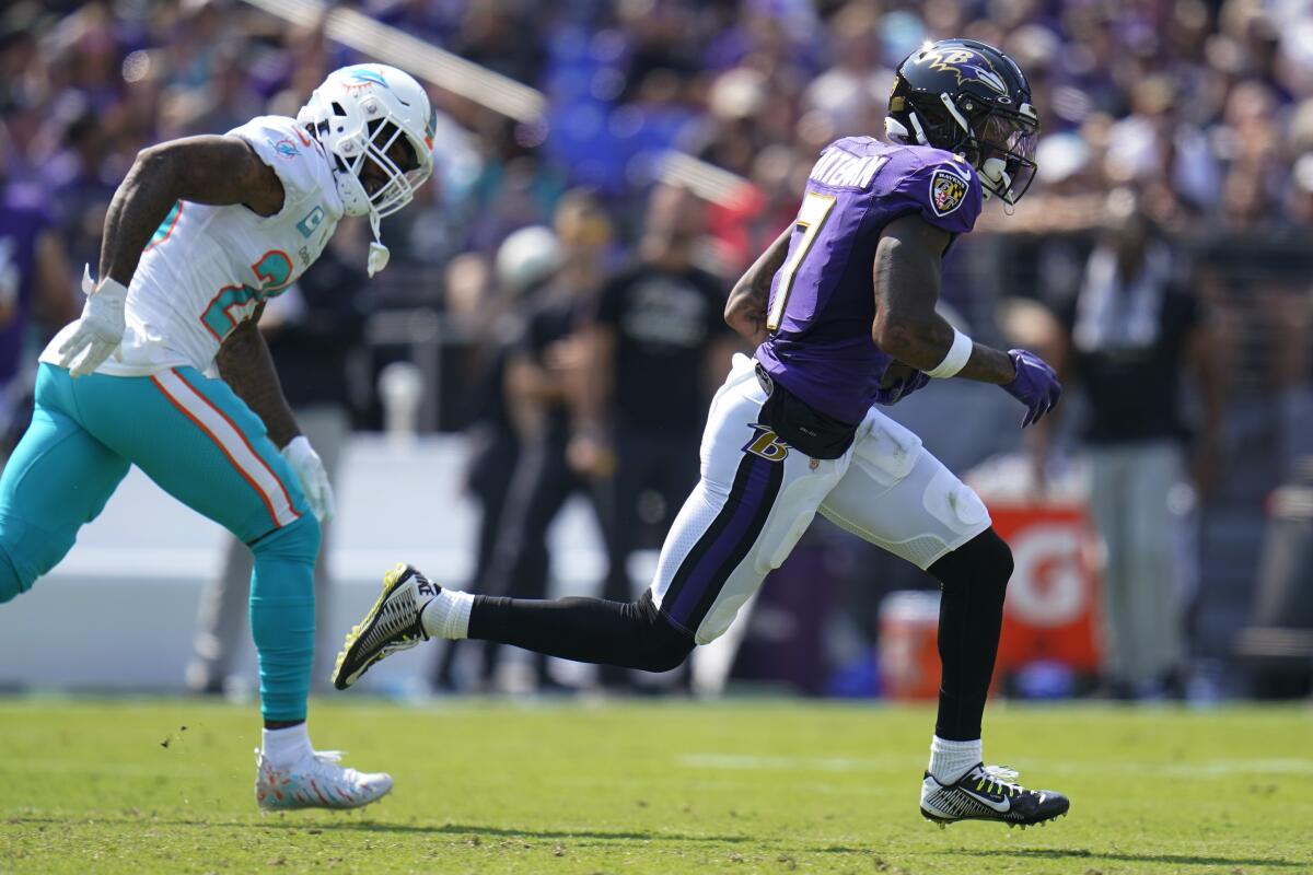 Baltimore Ravens wide receiver Rashod Bateman (7) runs for a touchdown during the first half of an NFL football game against the Miami Dolphins, Sunday, Sept. 18, 2022, in Baltimore. (AP Photo/Julio Cortez)