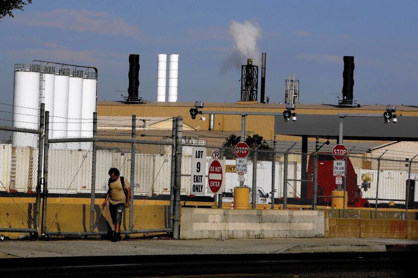 One year after the South Coast Air Quality Management District found that arsenic emissions from the Exide plant posed a cancer risk to more than 100,000 people, the agency has approved the company's plan to reduce health risks.
