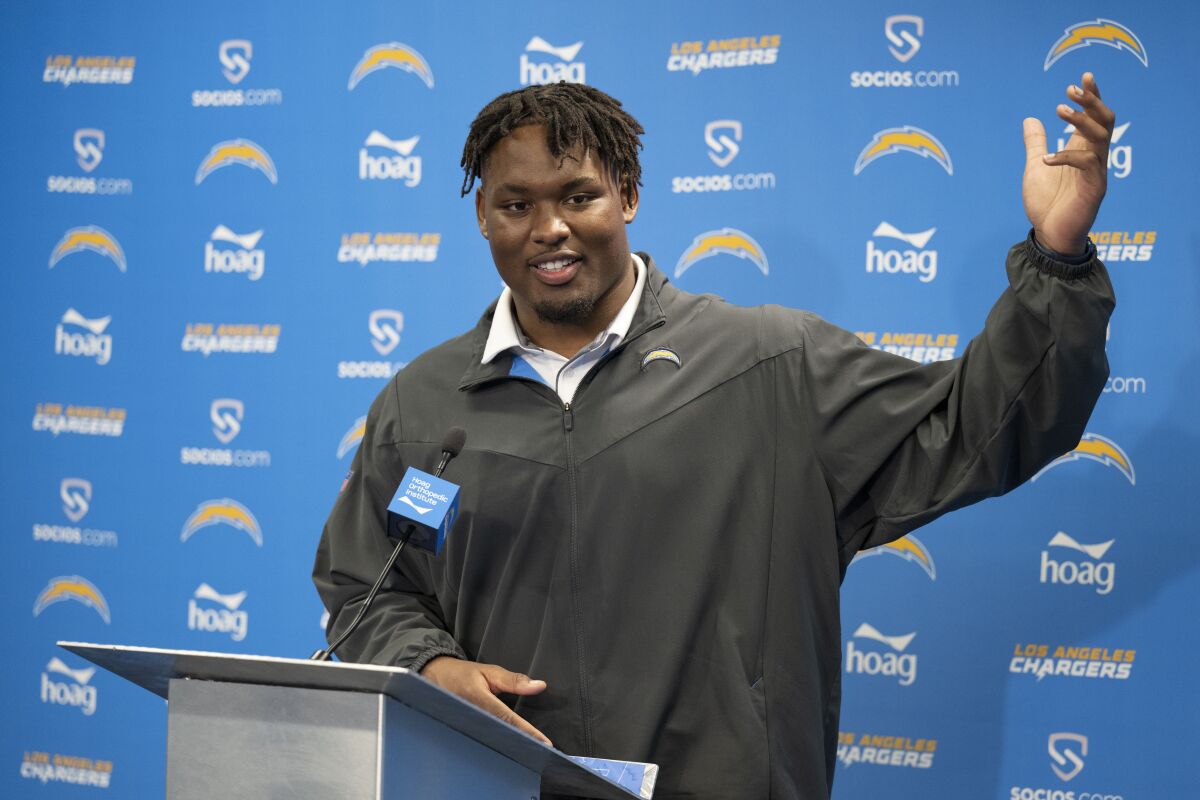 Chargers first-round draft pick Zion Johnson answers questions during a news conference.