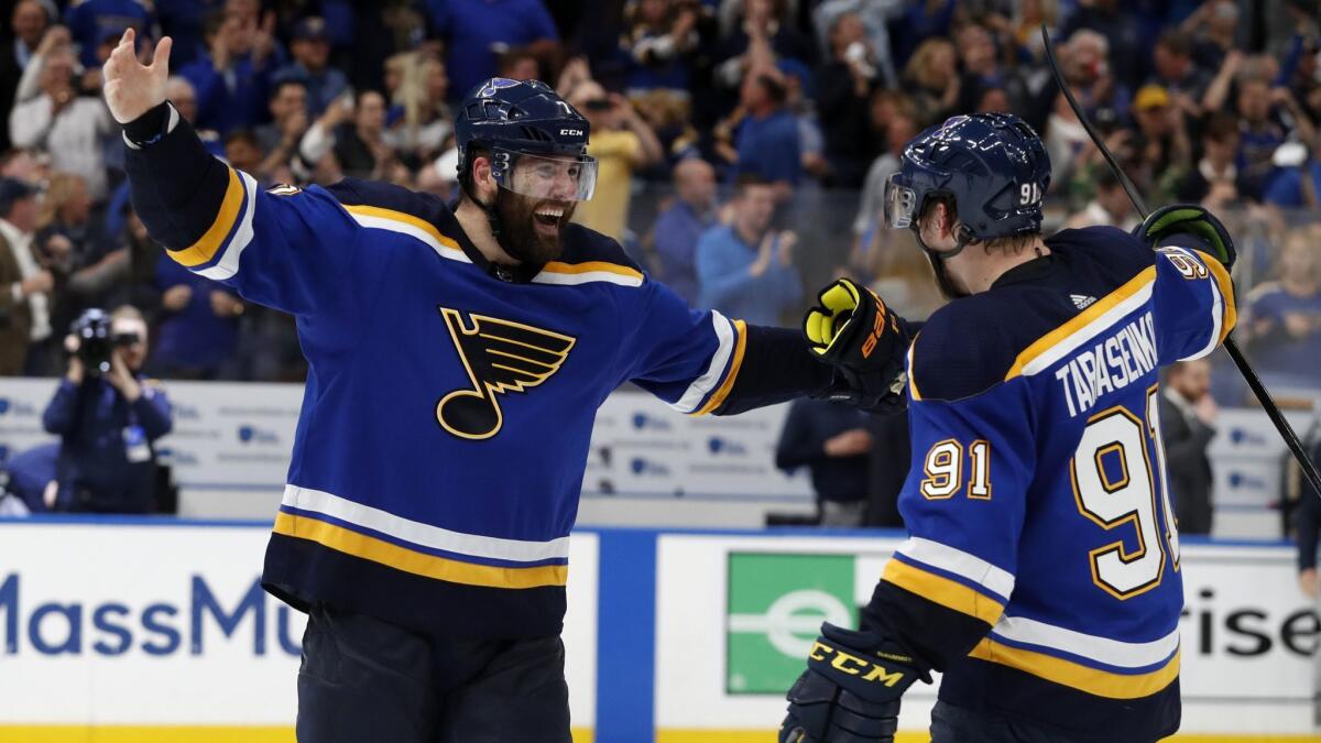 St. Louis Blues left wing Pat Maroon (7) and right wing Vladimir Tarasenko (91) celebrate the team's 2-1 win against the Dallas Stars in two overtimes in Game 7 of an NHL second-round playoff series on Tuesday.