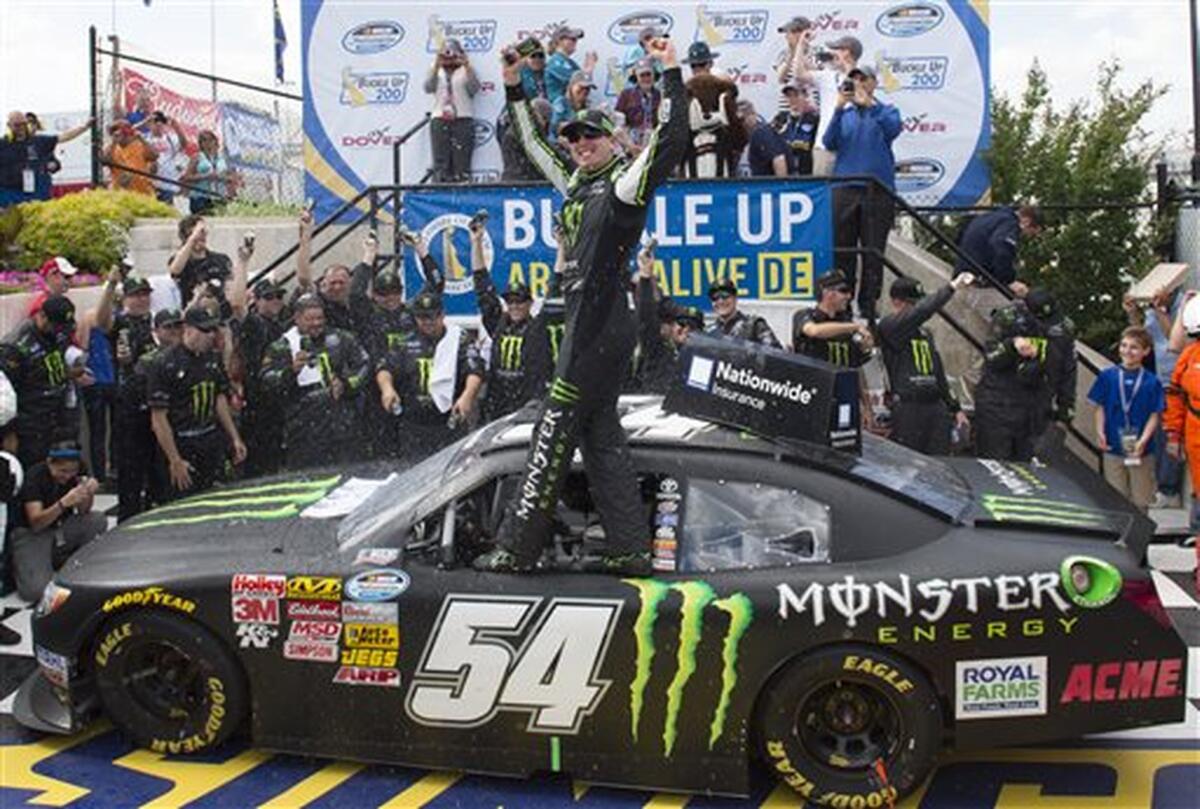 NASCAR driver Kyle Busch celebrates after winning a Nationwide series auto race at Dover International Speedway on May 31, 2014.
