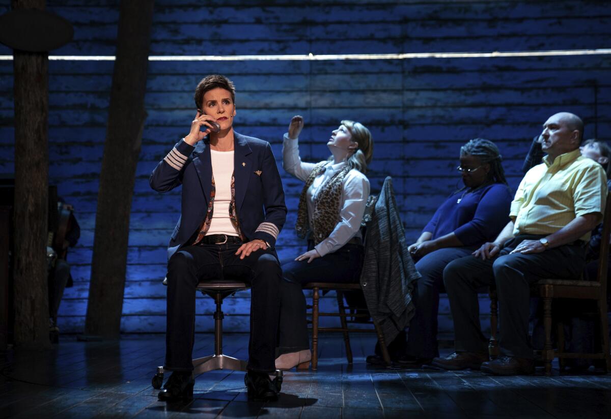 This image released by Apple TV+ shows Jenn Colella, left, in “Come From Away,” premiering Sept. 10, 2021. (Apple TV+ via AP)