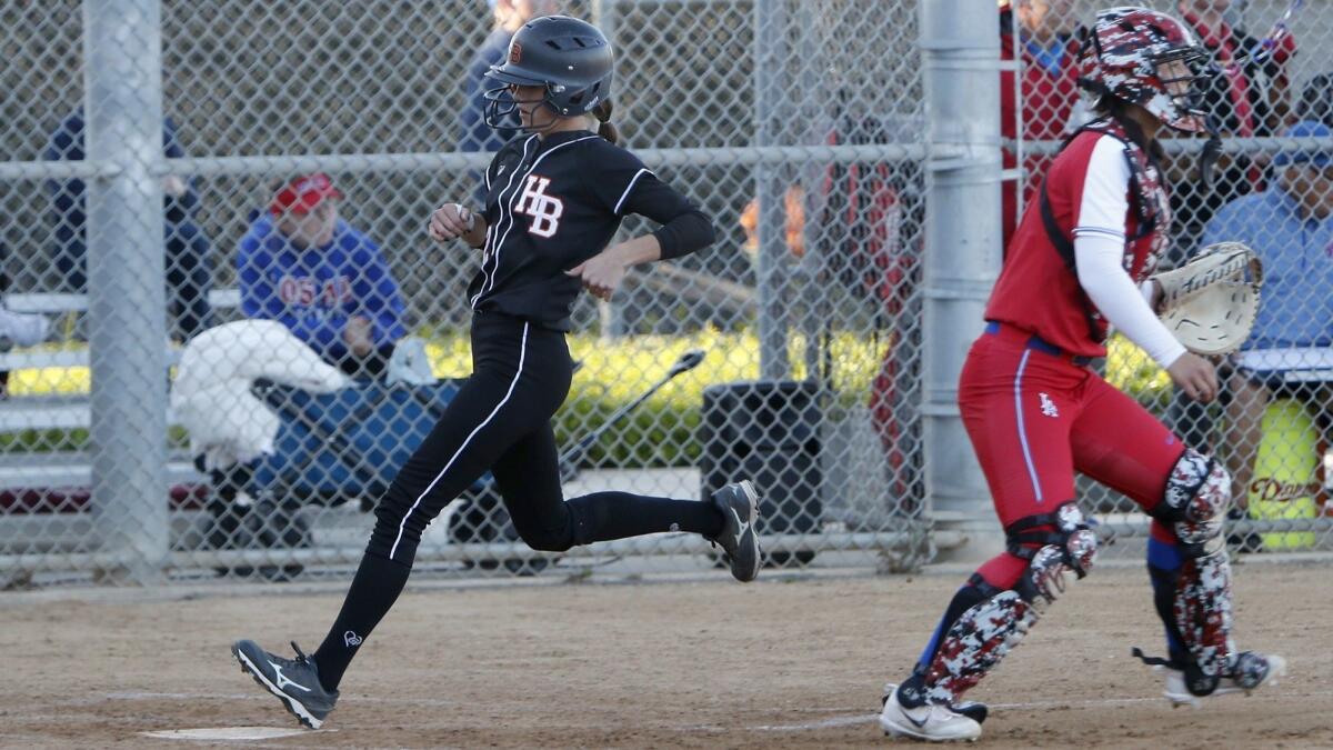 Jadelyn Allchin, shown scoring a run on April 17, homered twice in Huntington Beach High's 16-4 win at Riverside Poly in the first round of the CIF Southern Section Division 1 playoffs on Thursday.