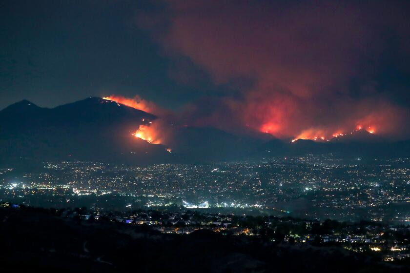 The Airport fire down Santiago Peak in Trabuco Canyon as seen from Alta Laguna Park in Laguna Beach on Monday.