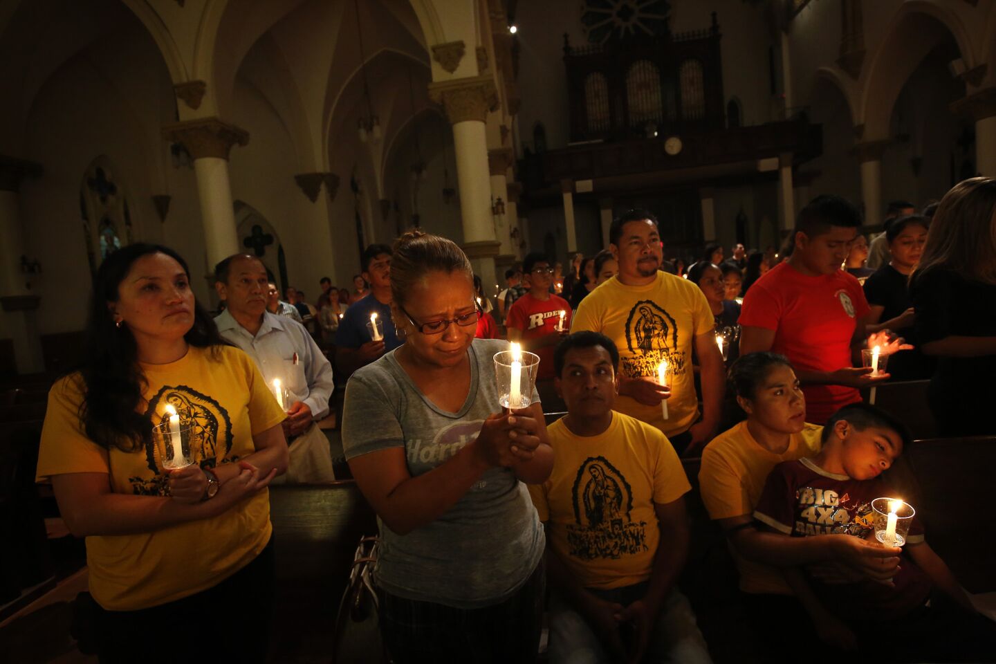 Dallas residents join in a "United to Heal" prayer vigil at the Cathedral Guadalupe the day after the sniper attack that left five officers dead.
