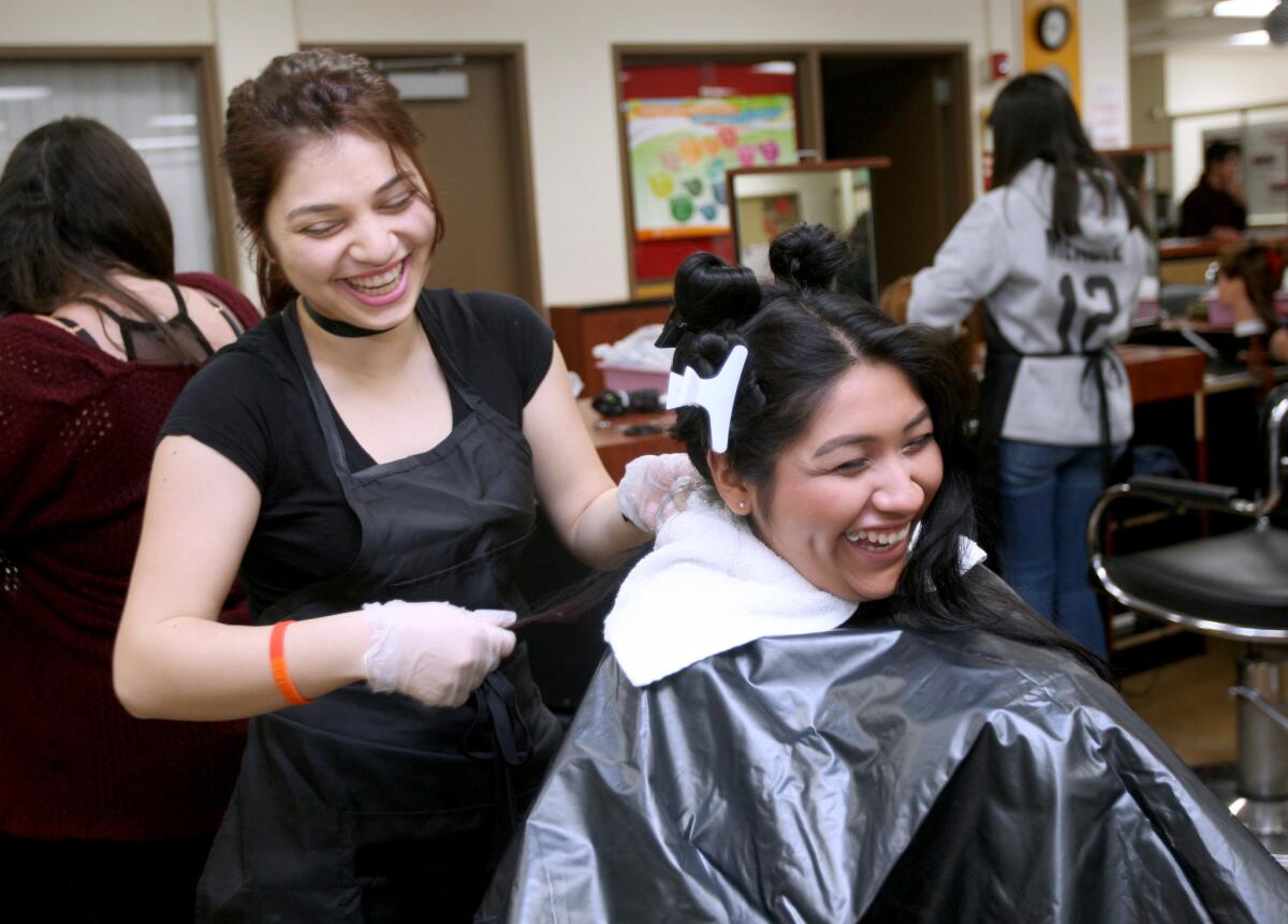 ROP program student Rita Chilgevorgian, left, prepares to color fellow ROP student Cinthya Fernandez' hair during Cosmetology class at at Glendale High School, in Glendale on Friday, May 6, 2016.