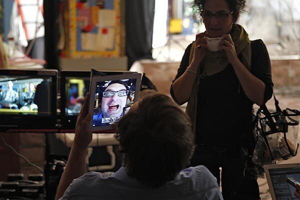 Eric Wareheim photographs himself with an iPad between takes.