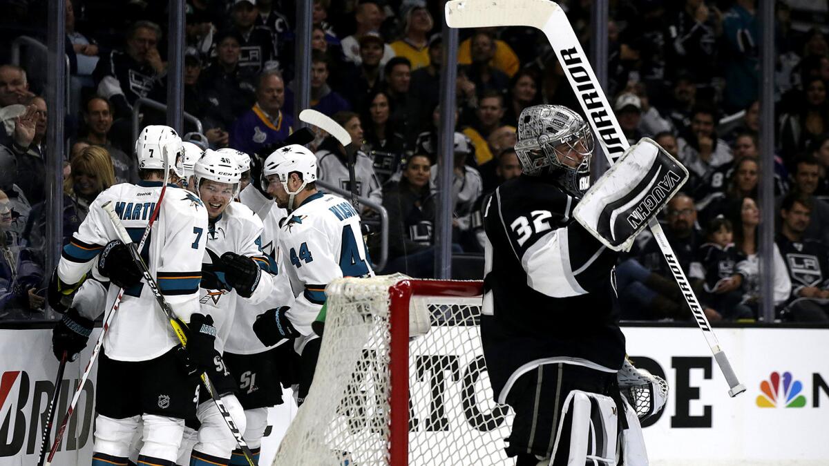 Sharks players celebrate a goal after center Tomas Hertl beat Kings goalie Jonathan Quick during the second period Thursday.