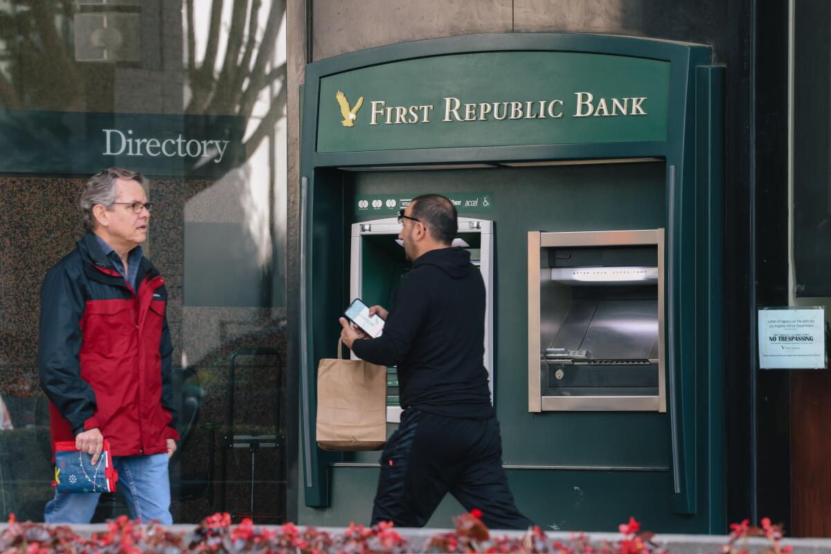 People pass the First Republic Bank in downtown Los Angeles.