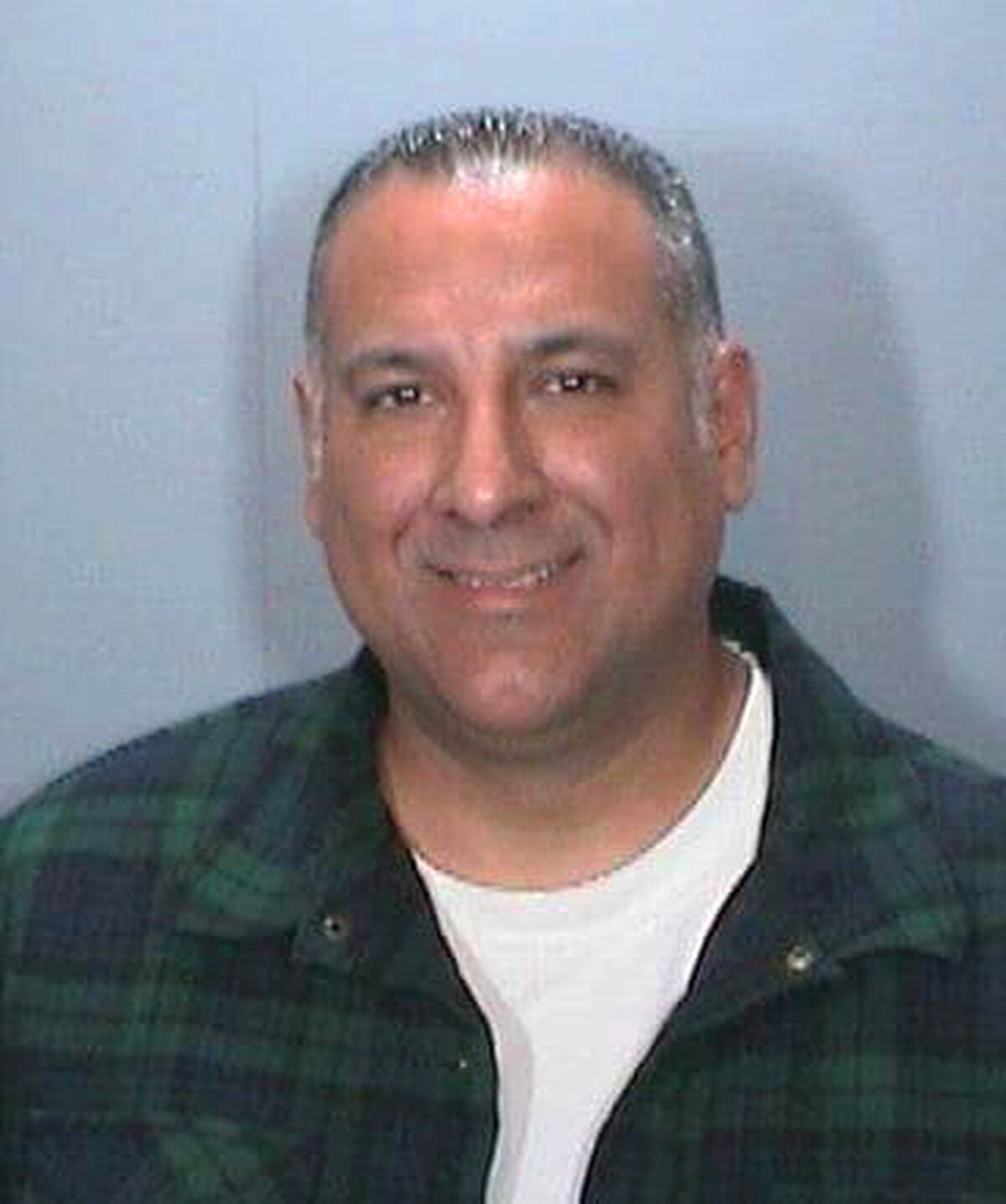 FILE - This undated booking photo released by the Orange, Calif., Police Department shows Los Angeles Police Officer Matthew Calleros. The veteran Los Angeles police officer was sentenced to six months in jail after pleading guilty to stealing a $29,000 pickup truck from a dealership, according to court records. (Orange Police Department via AP, File)