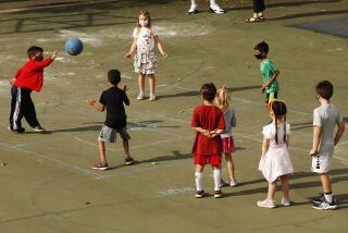 PALOS VERDES, CA - NOVEMBER 05: Second grade students working on social distance on the playground at Chadwick School in Palos Verdes which is open for kindergarten to second grade with later grades coming back to campus soon. There is wide latitude in terms of how schools can bring kids back to campus In LA County. One option is waivers, while the other is a stipulation that allows schools to bring back 25% of their populations if the students are high needs. Smaller school districts and private schools in more affluent areas are taking advantage of it in greater ways than school districts, raising another set of equity concerns around what children are getting in-person education sooner. Chadwick School on Thursday, Nov. 5, 2020 in Palos Verdes, CA. (Al Seib / Los Angeles Times