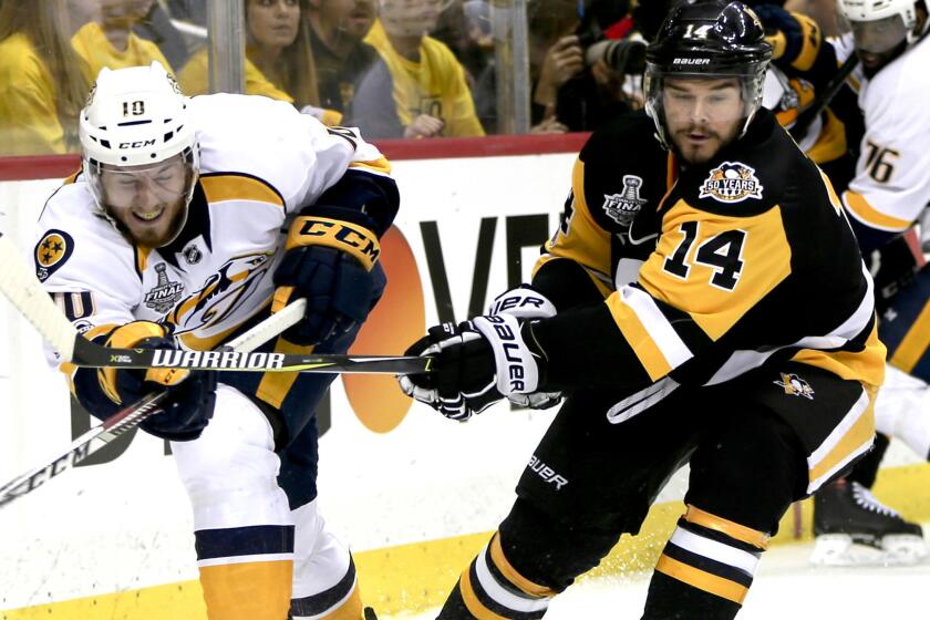 Nashville Predators' Colton Sissons (10) gets the puck away from \tp14n during the second period in Game 2 of the NHL hockey Stanley Cup Final, Wednesday, May 31, 2017, in Pittsburgh. (AP Photo/Keith Srakocic)