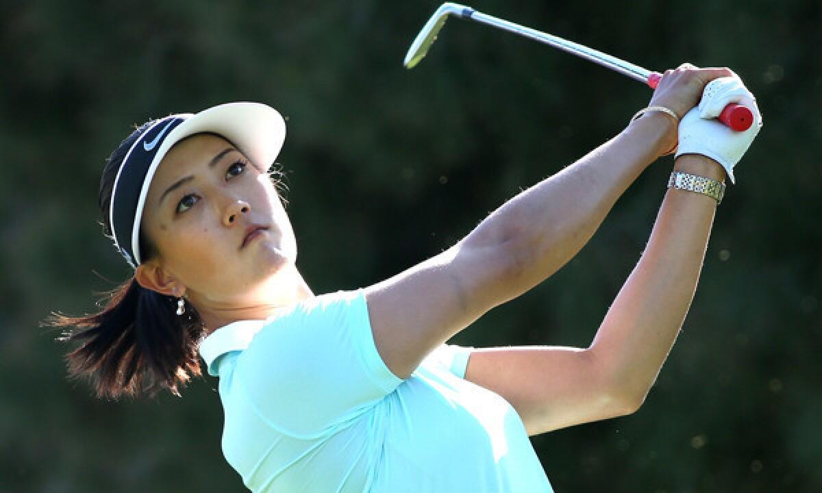 Michelle Wie hits her tee shot on the 17th hole during the first round of the Kraft Nabisco Championship at Mission Hills Country Club in Rancho Mirage on Thursday.