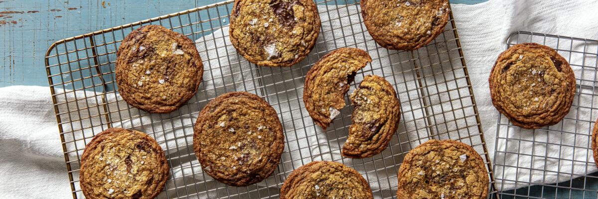 Cookies sit atop a cooling rack