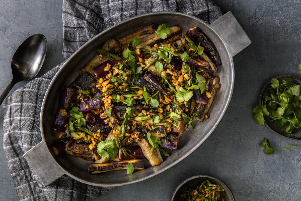 Stir-fried eggplant topped with peanuts, scallions and ginger.