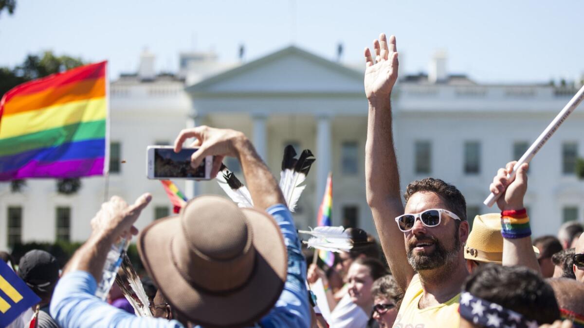 Demonstrators walk past the White House during the Equality March for Unity and Peace on June 11, 2017. Thousands around the country participated in marches for the LGBTQ communities, with the central march taking place in Washington.