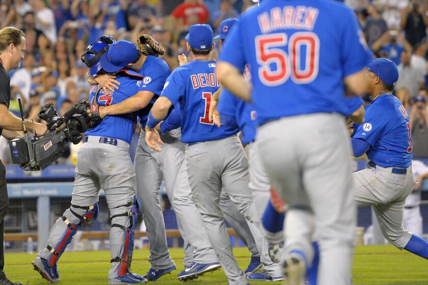 Jake Arrieta celebrates with teammates after throwing his first career no-hitter.