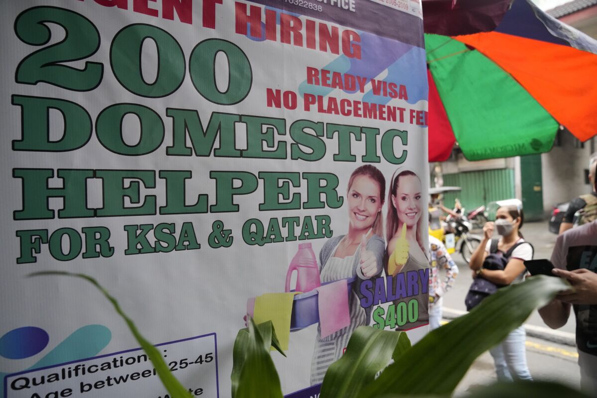 Sign advertising jobs for domestic helpers in the Mideast
