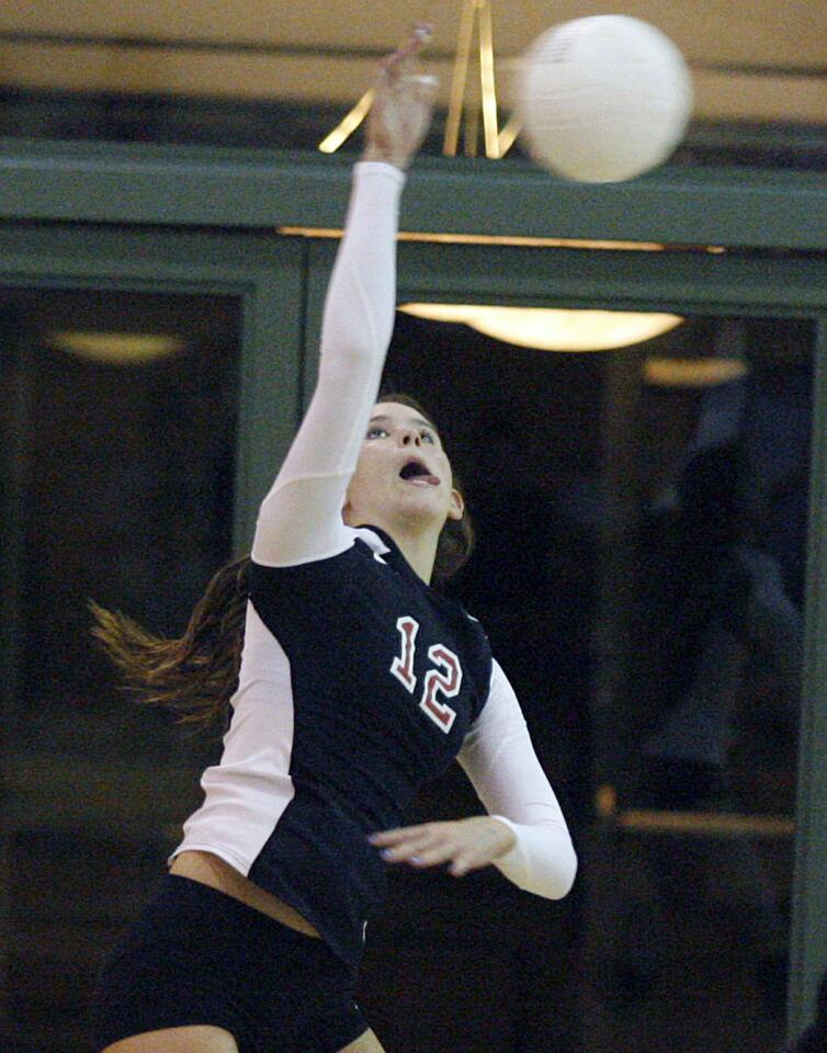 FSHA's Ali McCollum spikes the ball during a match against Harvard-Westlake at FSHA in La Canada l on Tuesday, October 2, 2012.