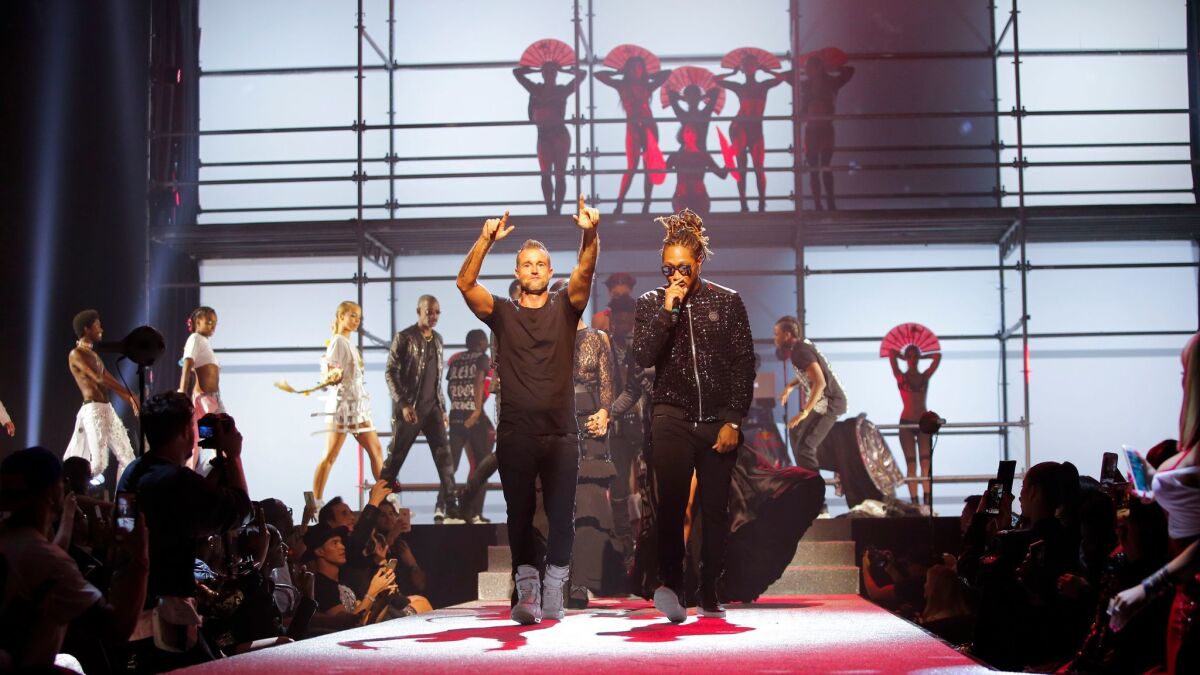 Philipp Plein, left, and Future hit the runway at the finale of the designer's spring and summer 2018 runway show at the Hammerstein Ballroom on Sept. 9, 2017, during New York Fashion Week.