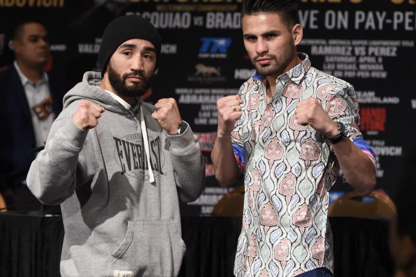 Manny Perez, left, and Jose Ramirez pose for photographers at a news conference this week in advance of their fight Saturday at MGM Grand Arena in Las Vegas.