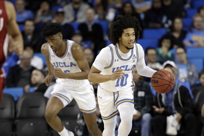 UCLA guard Tyger Campbell controls the ball during a win over Washington State on Thursday.