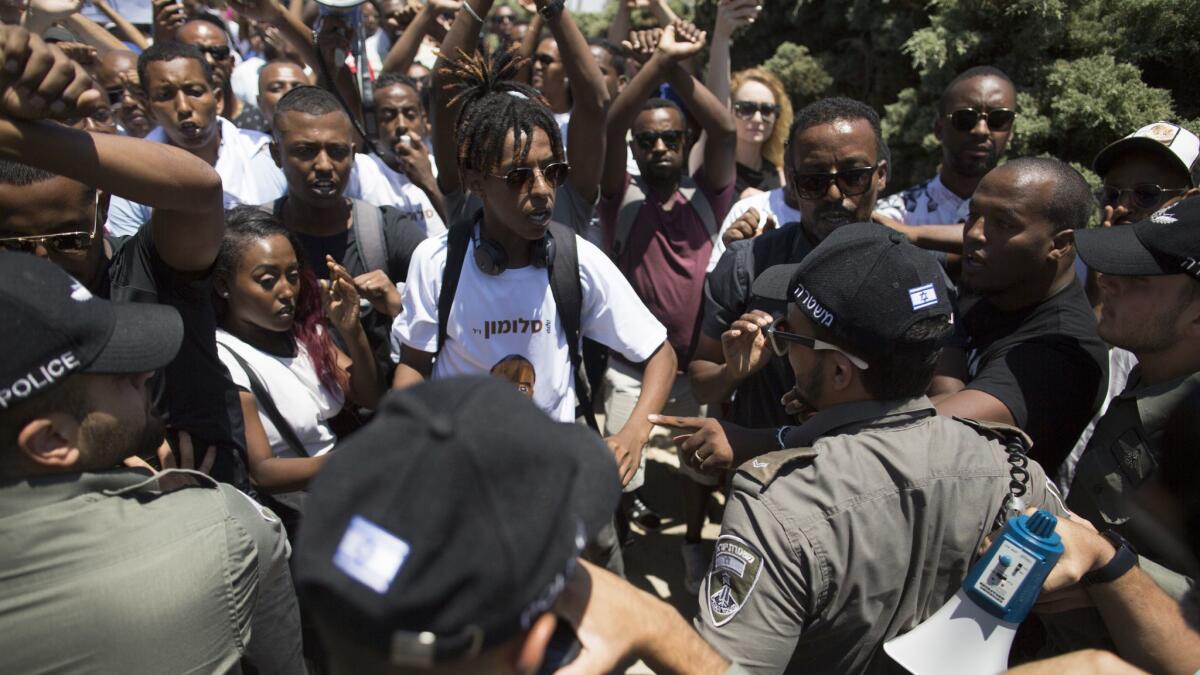 Israeli Security forces clash with Israelis of Ethiopian origin as they protest outside the Knesset on July 15 in Jerusalem. The protests follow the death of a young man of Ethiopian origin who was killed by an off-duty police officer.