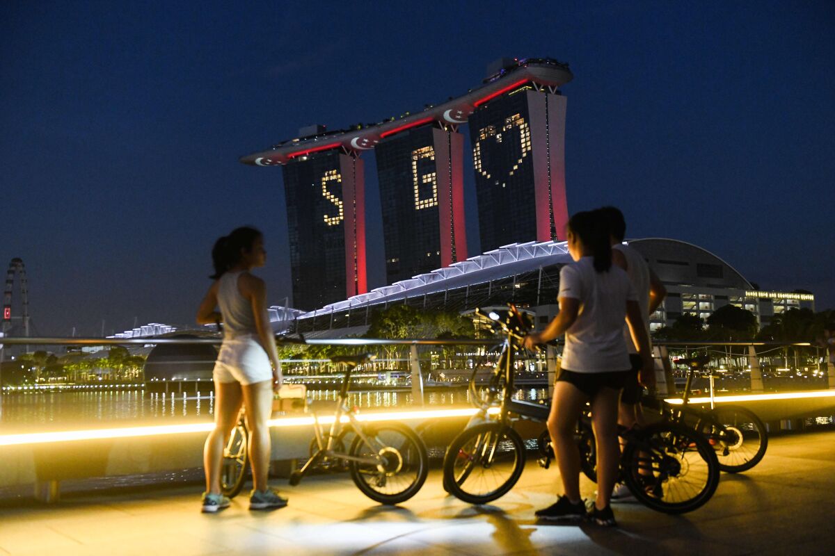 Lights adorn Marina Bay Sands, a landmark hotel in Singapore, on April 10.