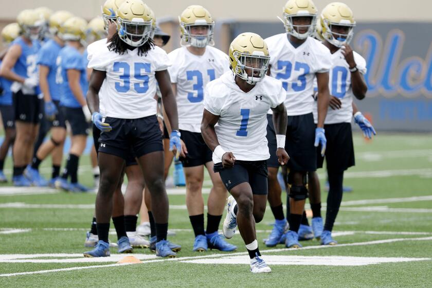 LOS ANGELES, CALIF. -- WEDNESDAY, JULY 31, 2019: Darnay Holmes (1), defensive back, along with teammates runs through drills at fall football camp practice at the Wasserman Football Center on the campus of UCLA in Los Angeles, Calif., on July 31, 2019. (Gary Coronado / Los Angeles Times)