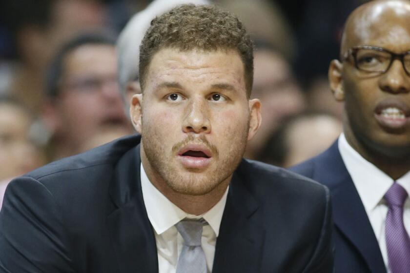 Blake Griffin watches as the Clippers play Miami on Jan. 13.