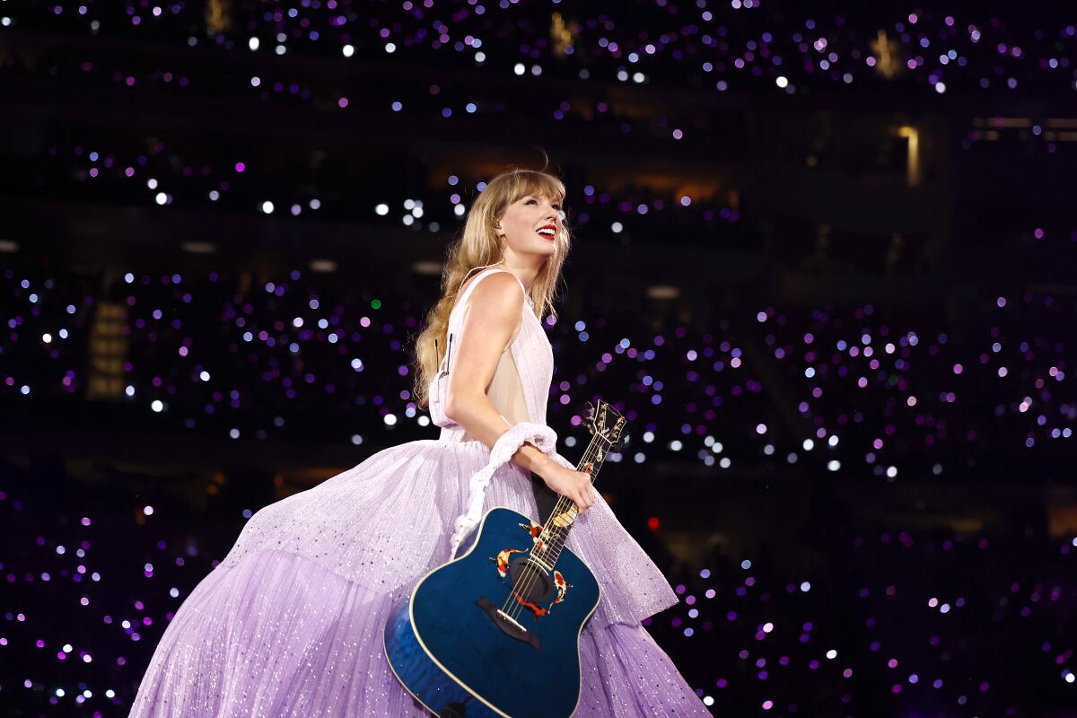 Taylor Swift performs onstage.