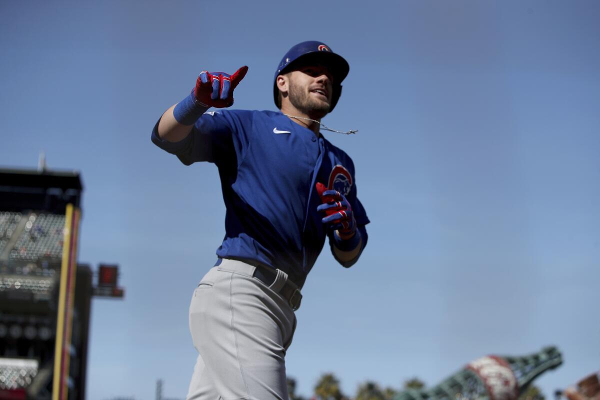 Patrick Wisdom of the Chicago Cubs runs the bases after hitting a two