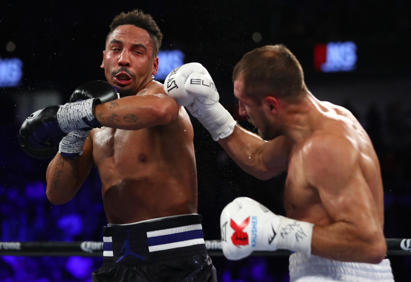 Andre Ward, left, sends Sergey Kovalev reeling with a punch to the head during their light-heavyweight title fight on Nov. 19. 2016 in Las Vegas.