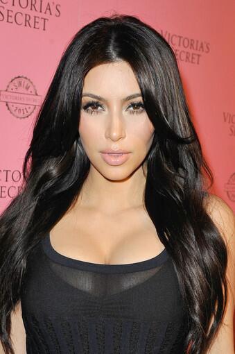 Kim Kardashian arrives at the 2011 Victoria's Secret Swim Collection Pink Carpet Event at Club L in Los Angeles.