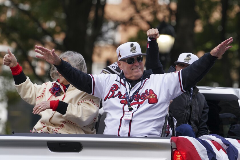 Atlanta Braves manager Brian Snitker celebrates the team's victory during a victory parade, Friday, Nov. 5, 2021, in Atlanta. The Braves beat the Houston Astros 7-0 in Game 6 on Tuesday to win their first World Series baseball title in 26 years. (AP Photo/Brynn Anderson)