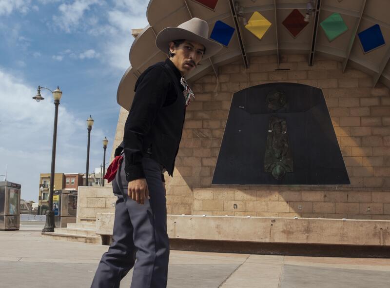 Steve Corona wears ranchero style clothing while skating at Mariachi Plaza in Boyle Heights on Friday, September 23, 2023.